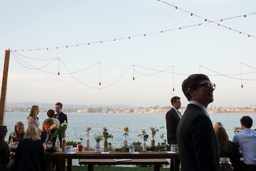 Daytime reception on the sand with string lights at The Garty Pavilion.
