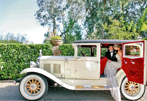 Brilliant Event Design bride and groom getting into a classic car.